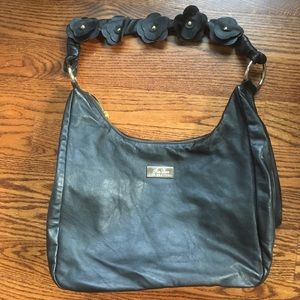 Large black leather shoulder bag with gold details